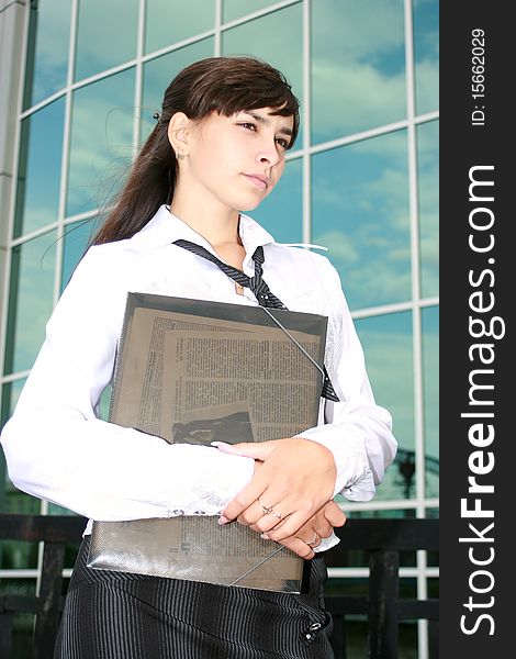 Businesswoman on a background office building. Businesswoman on a background office building