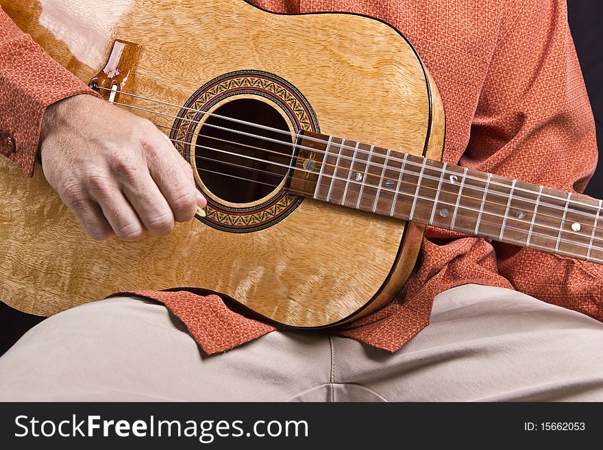 Acoustic guitar being played up close. Acoustic guitar being played up close