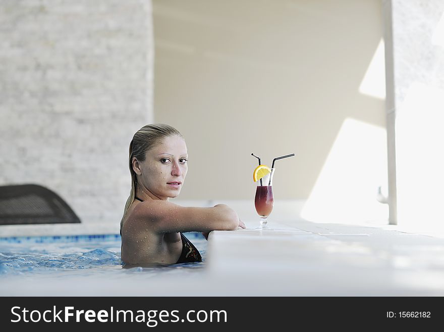 Beautiful young woman enjoy sun and coctail dring relaxing and have fun at siwmming pool. Beautiful young woman enjoy sun and coctail dring relaxing and have fun at siwmming pool