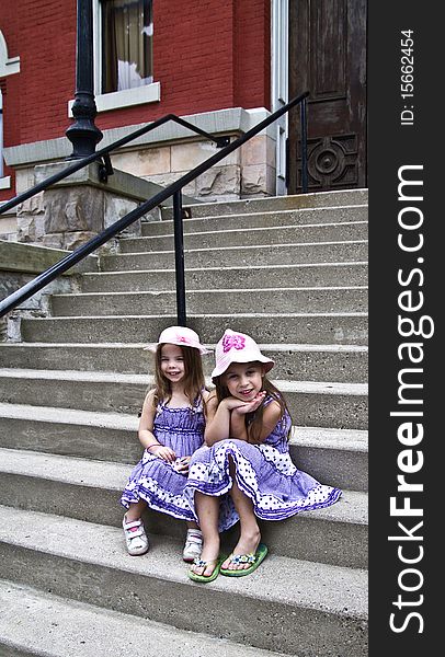 Sisters pose on the steps of the county courthouse