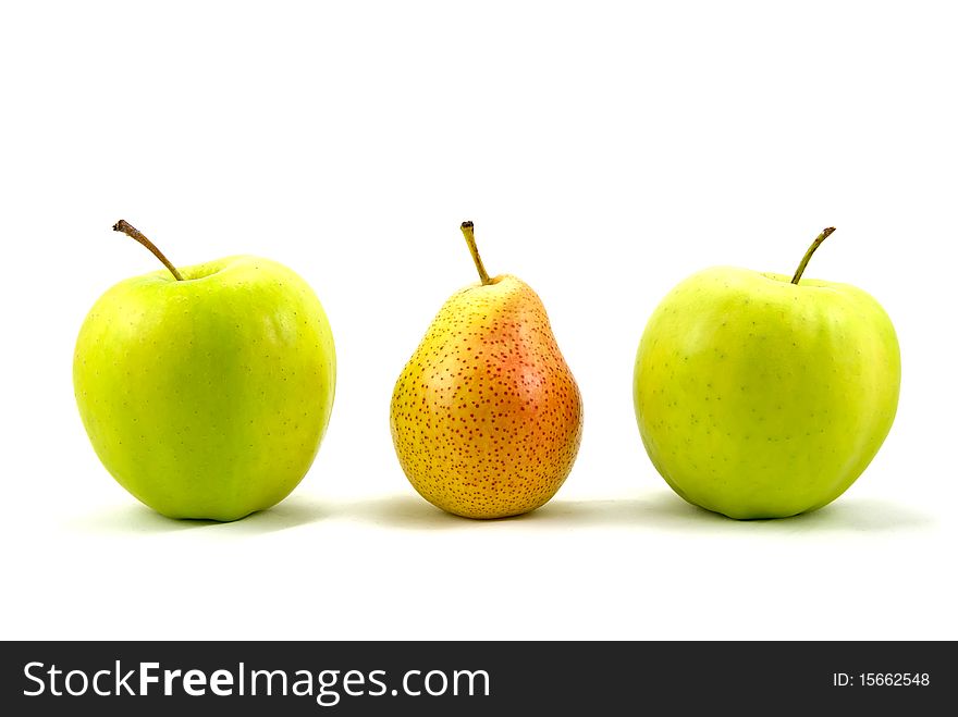 Green apples with the pear standing out from the crowd - over a white background. Green apples with the pear standing out from the crowd - over a white background