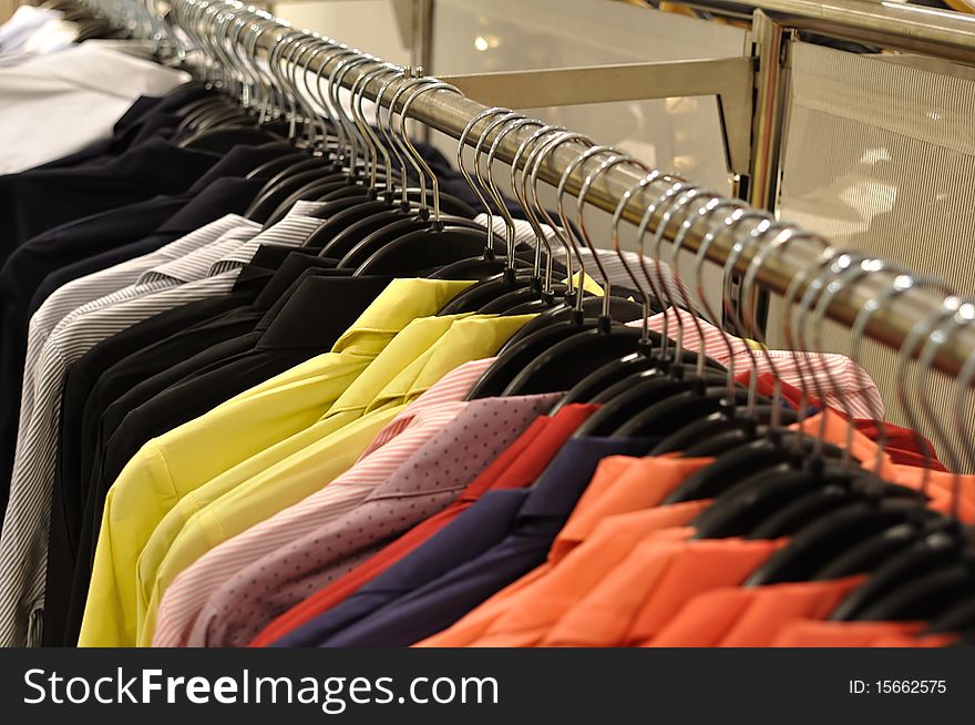 Colorful shirt in row in shop, sale in mall