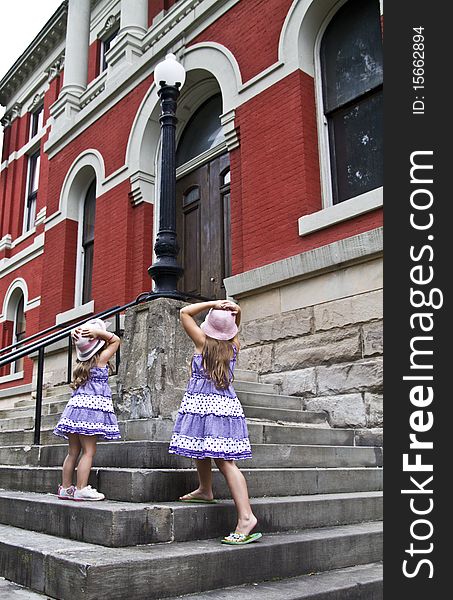 Sisters take an overwhelming view of the county courthouse. Sisters take an overwhelming view of the county courthouse