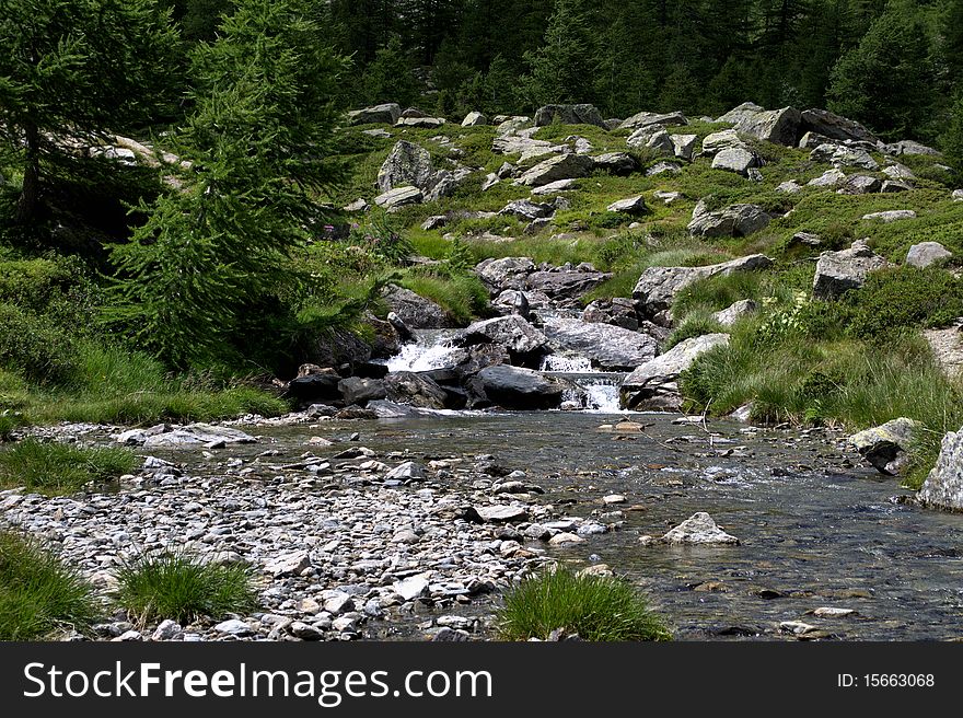 River by the mountain of the Aosta Valley. River by the mountain of the Aosta Valley.