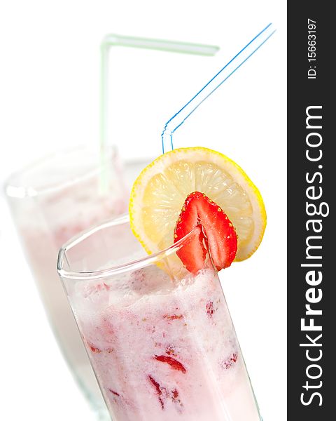 Milkshake with strawberries in a glass beaker. Milkshake with strawberries in a glass beaker