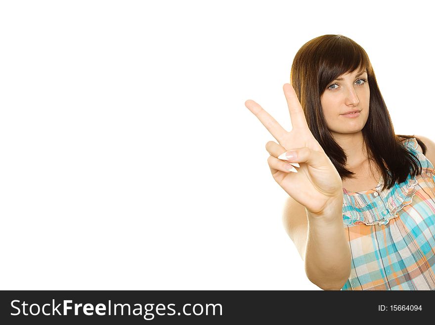 Young smiling woman making victory gesture. Isolated on white background. Young smiling woman making victory gesture. Isolated on white background