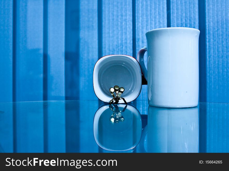 White cup isolated on a bule background