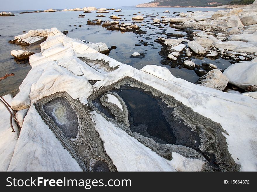 Blocks of marble in the sea on Aliki, Thassos island, Greece