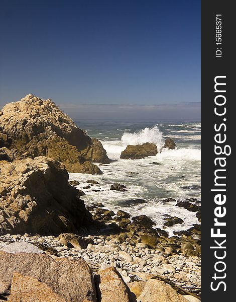 The Magnificent Pacific Coast showing surf and boulders