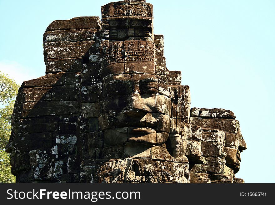 face tower of the king Jayavarman VII against blue sky in the temple of The Bayon, Angkor, Siem Riep, Cambodia.

. face tower of the king Jayavarman VII against blue sky in the temple of The Bayon, Angkor, Siem Riep, Cambodia.