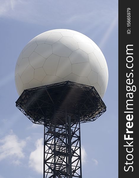 White big sphere of radar station on blue sky background