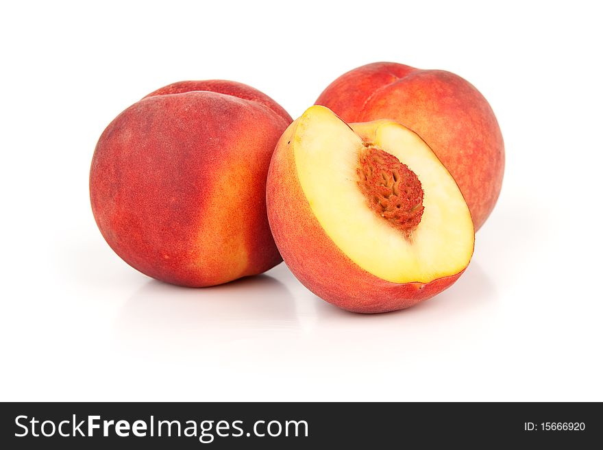 Fresh peaches on white background