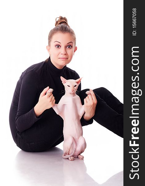 Beautiful young woman with a cat on a white background