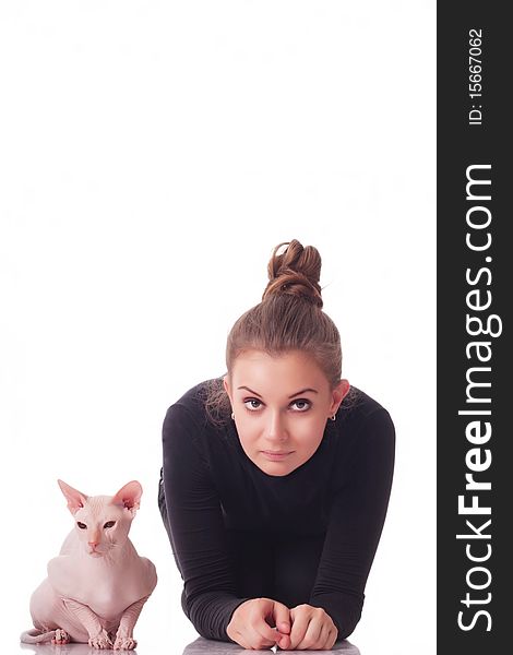 Beautiful young woman with a cat on a white background