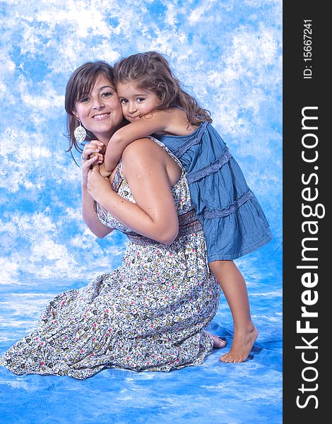 Mother and daughter play on studio