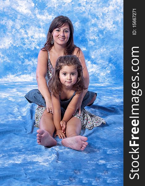 Mother and daughter play on studio
