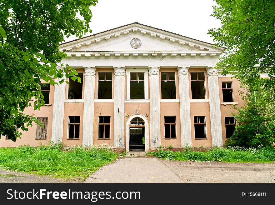 The photograph shows an abandoned Soviet House. The photograph shows an abandoned Soviet House