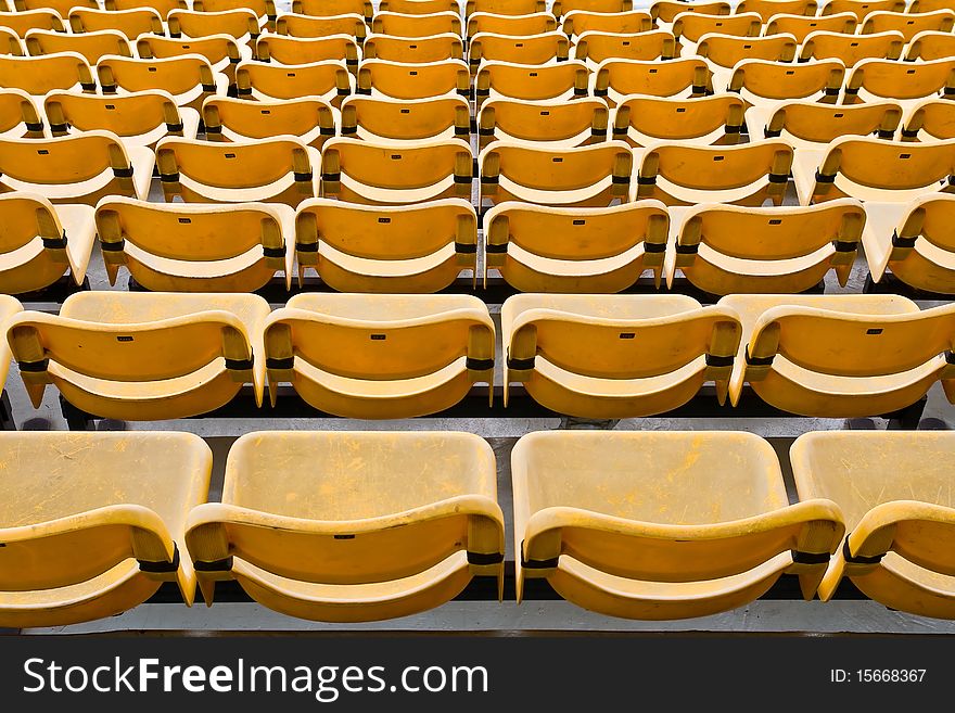 Yellow Seat Pattern in Football Stadium