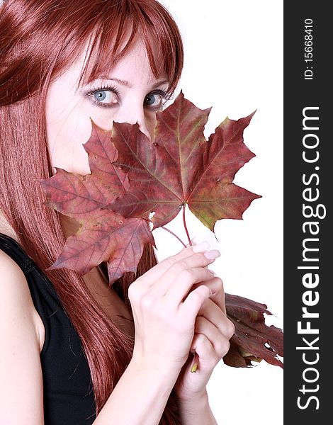 Beautiful young woman with red hair and maple leaves. Beautiful young woman with red hair and maple leaves