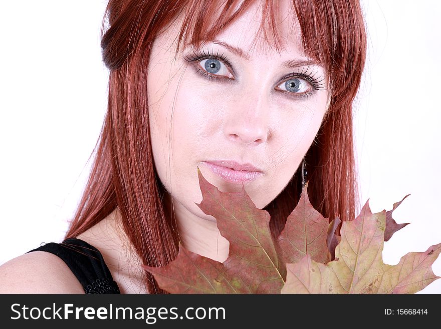 Beautiful young woman with red hair and maple leaves. Beautiful young woman with red hair and maple leaves