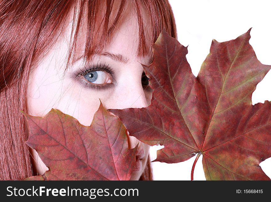 Beautiful young woman with red hair and maple leaves. Beautiful young woman with red hair and maple leaves