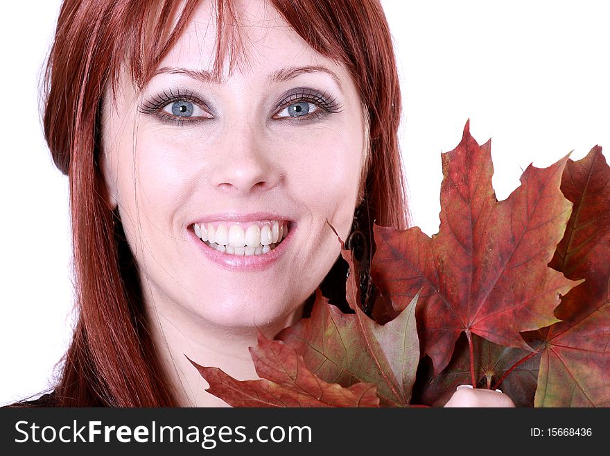 Beautiful young woman with red hair and maple leaves. Beautiful young woman with red hair and maple leaves