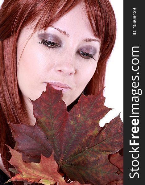 Beautiful young woman with red hair and maple leaves. Beautiful young woman with red hair and maple leaves