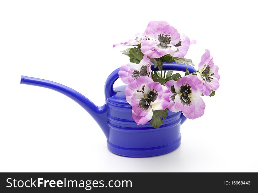 Blue plastic watering can with flower. Blue plastic watering can with flower
