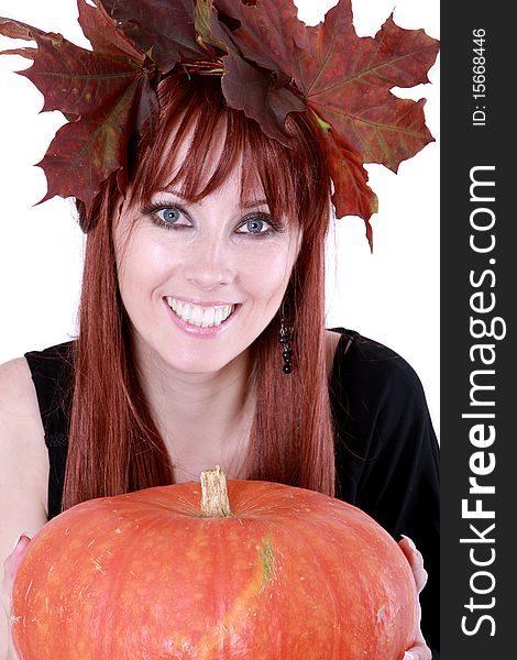 The girl with autumnal leaves and the pumpkin. The girl with autumnal leaves and the pumpkin