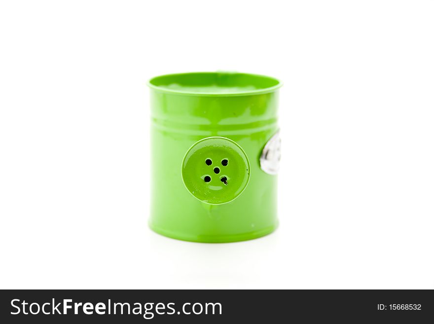 Metal watering can with opening turns green