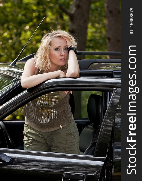 A woman driver reading a road map. A woman driver reading a road map