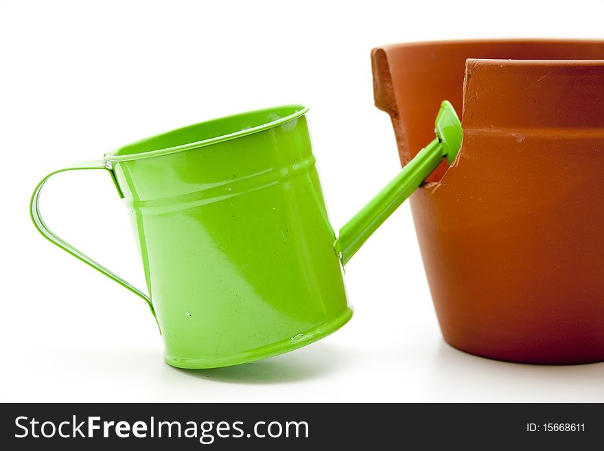 Watering can with flowerpot