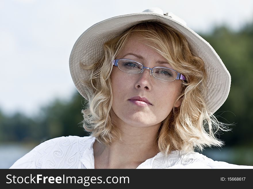 The beautiful blonde in the hat and glasses