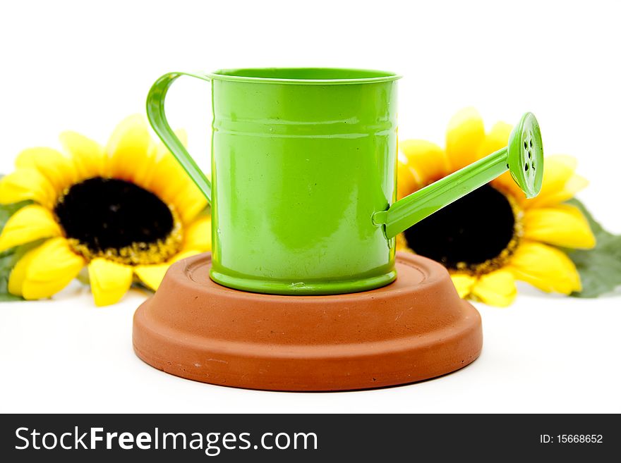 Watering can with sunflower