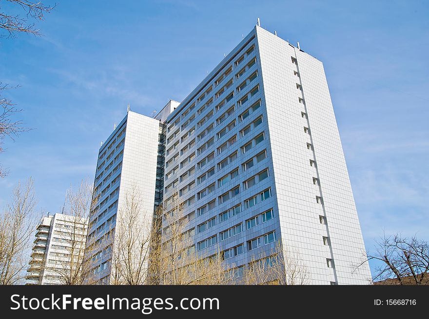 A residential building on a background of blue sky