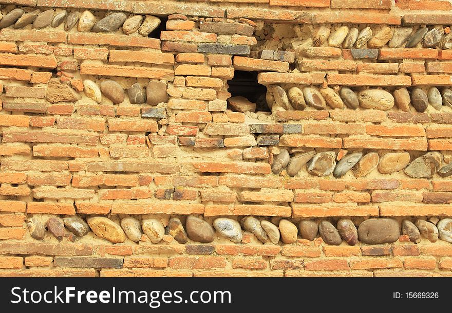 Ancient wall constructed with stones, bricks and mortar. Ancient wall constructed with stones, bricks and mortar