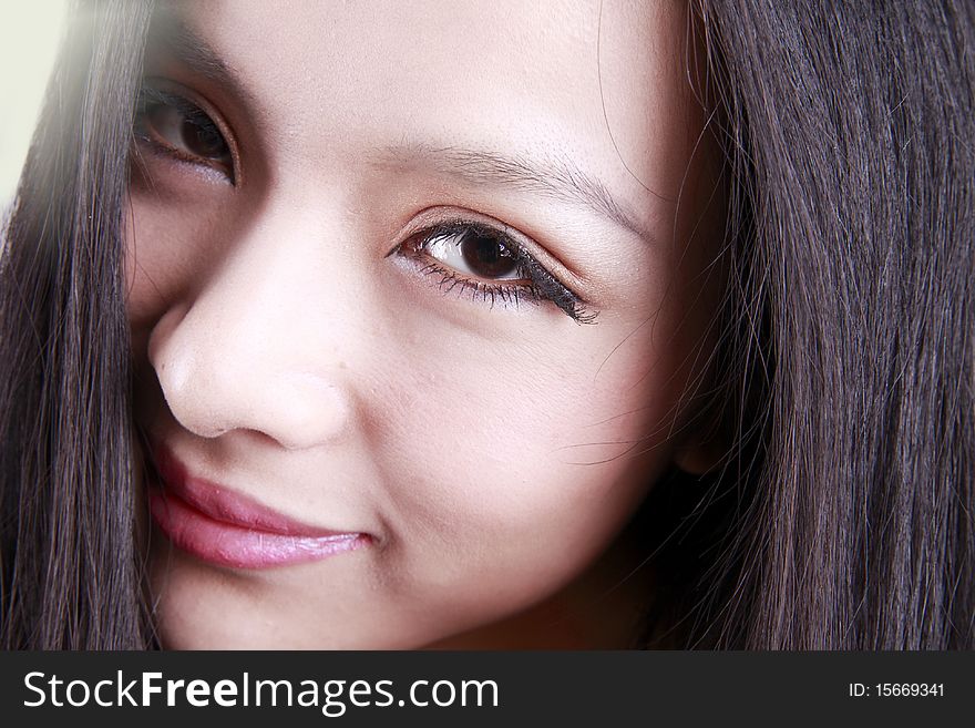 Close-up of Asian woman's face. She is a Chinese woman.
