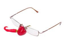 Two Red Chili Peppers With Reading Glases Royalty Free Stock Photography