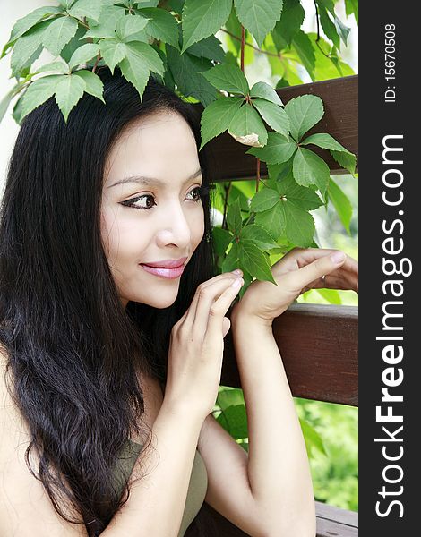 Beautiful Asian girl with long hair in the garden.(taken in August) She is a professional model. Beautiful Asian girl with long hair in the garden.(taken in August) She is a professional model.