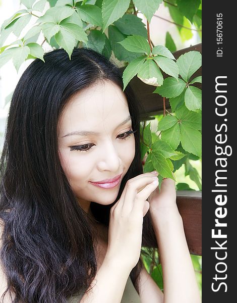 Beautiful Asain girl with long hair in the garden.(taken in August). Beautiful Asain girl with long hair in the garden.(taken in August)