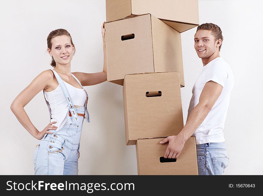 Young attractive couple with cardboard boxes. Young attractive couple with cardboard boxes