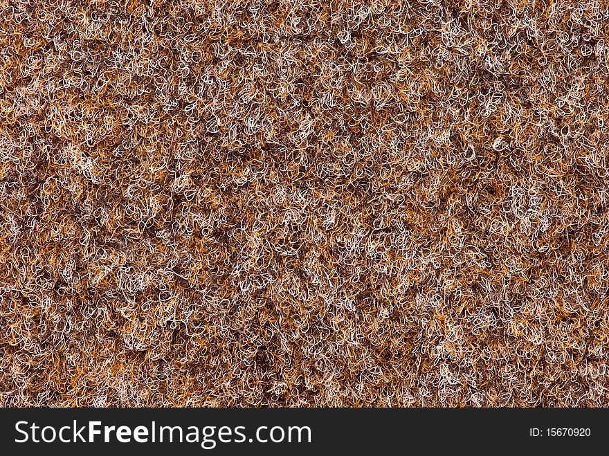 Texture of carpet coverage of brown color with a shallow nap