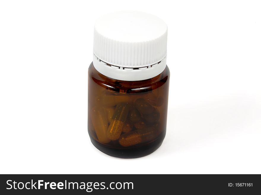Glass bottle with pills isolated on white; including clipping path