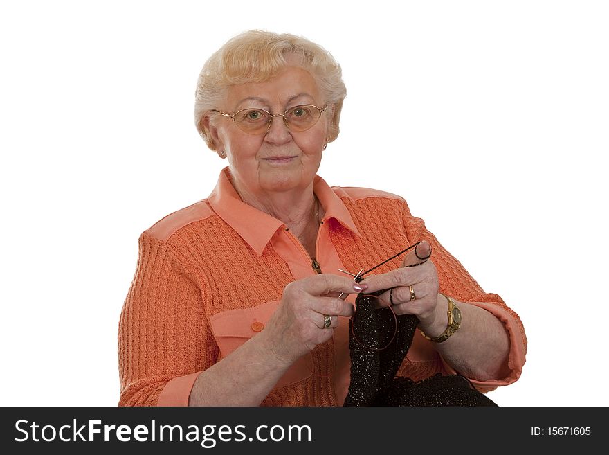 Old woman senior is knitting-isolated on white background