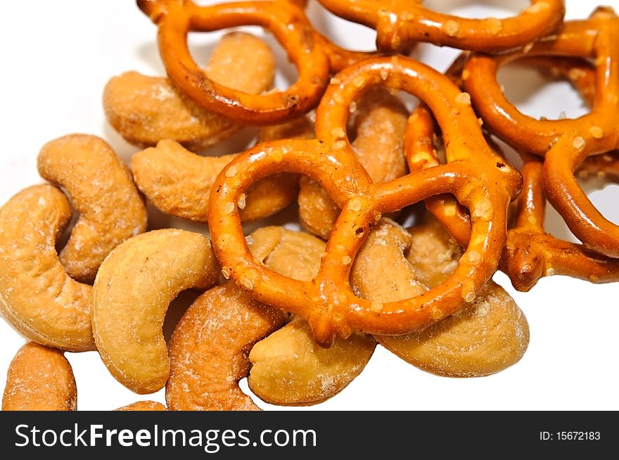 Closeup of some cashew nuts with pretzels. Good after school or bar snacks. Closeup of some cashew nuts with pretzels. Good after school or bar snacks.