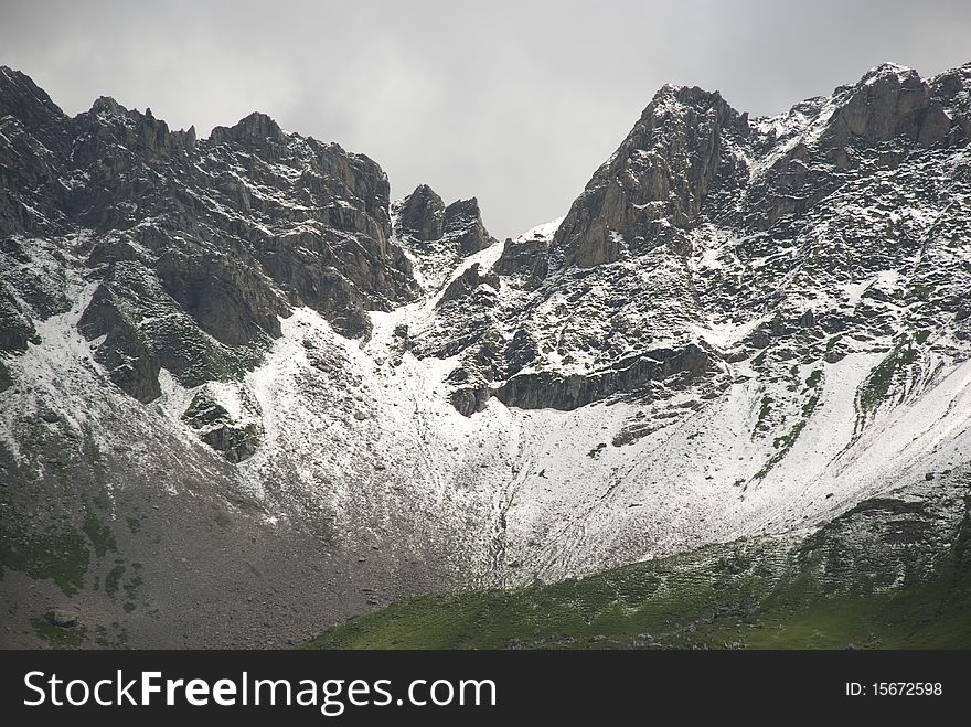 Peaks of snowcovered mountains in the alps. Peaks of snowcovered mountains in the alps