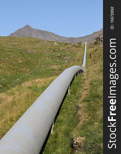 Water pipeline in the mountains of Snowdonia UK. Water pipeline in the mountains of Snowdonia UK.