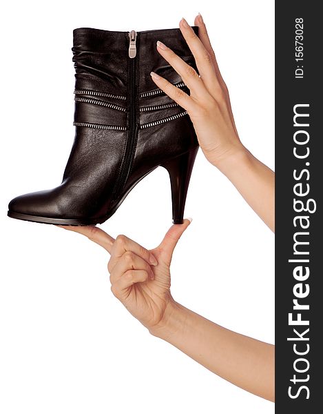 Black female boots in hands at the saleswoman. Black female boots in hands at the saleswoman