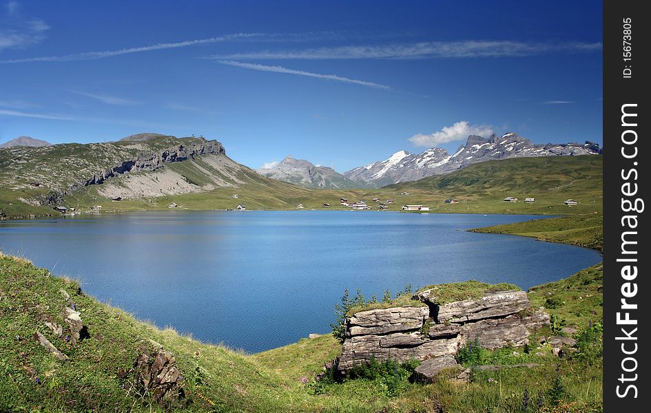 Sunny day on the lake Milchsee in swiss Alps. Sunny day on the lake Milchsee in swiss Alps