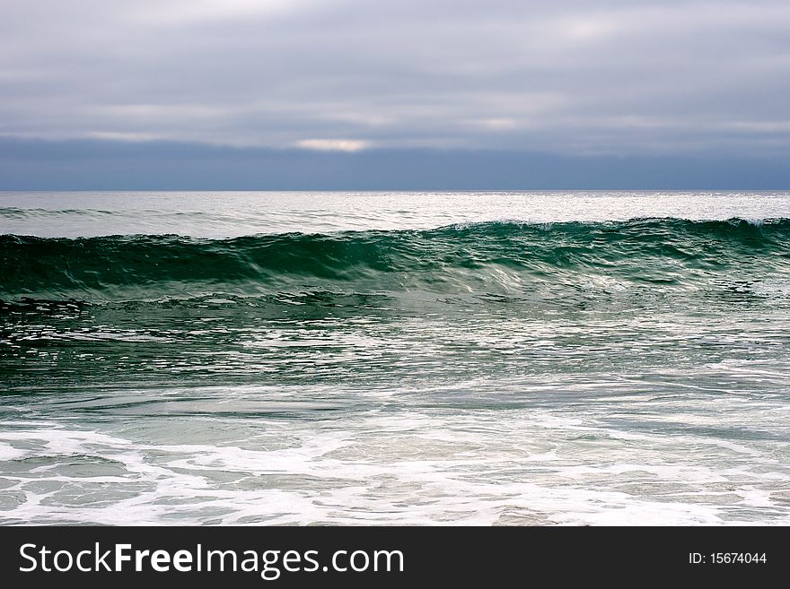 A wave growing larger by the second at a local beach in California.